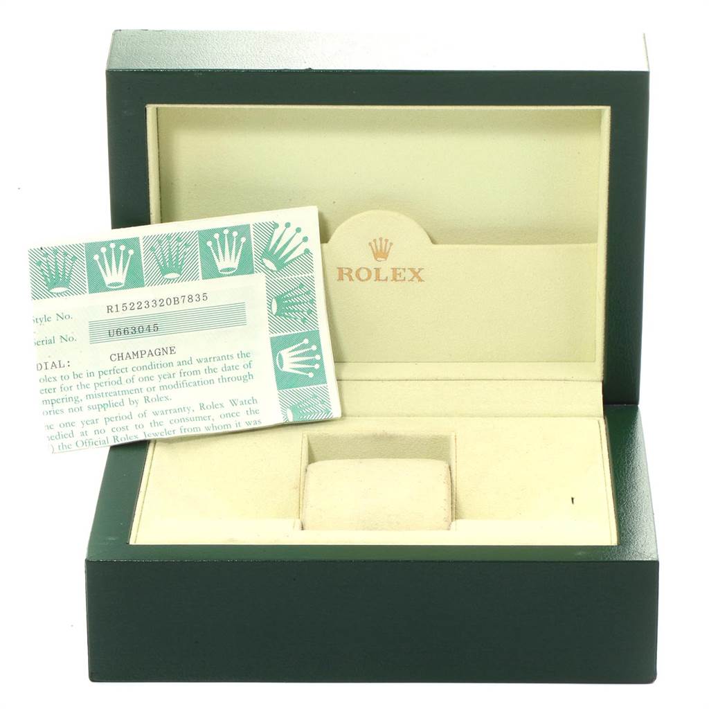 The image shows an open Rolex Date 15223 Men's Steel and Gold (two tone) Champagne Dial 15223 Men's Steel and Gold (two tone) Champagne Dial model watch box and warranty card.