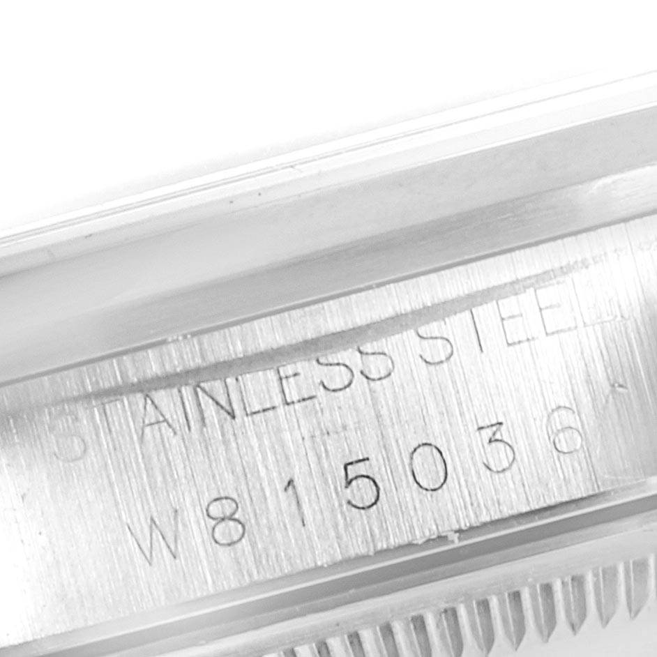 This image shows the side of a Rolex Date 15200 Men's Stainless Steel Silver Dial 15200 Men's Stainless Steel Silver Dial watch with the stainless steel label and part of the watch's serial number.