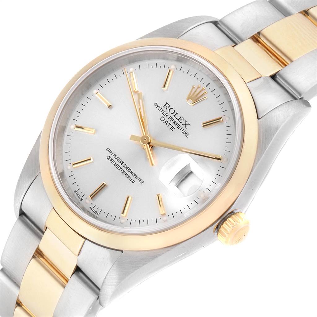 The image shows a Rolex Date 15203 Men's Steel and Gold (two tone) Silver Dial 15203 Men's Steel and Gold (two tone) Silver Dial model watch from an angled top-down view, highlighting the face, bezel, crown, and part of the bracelet.