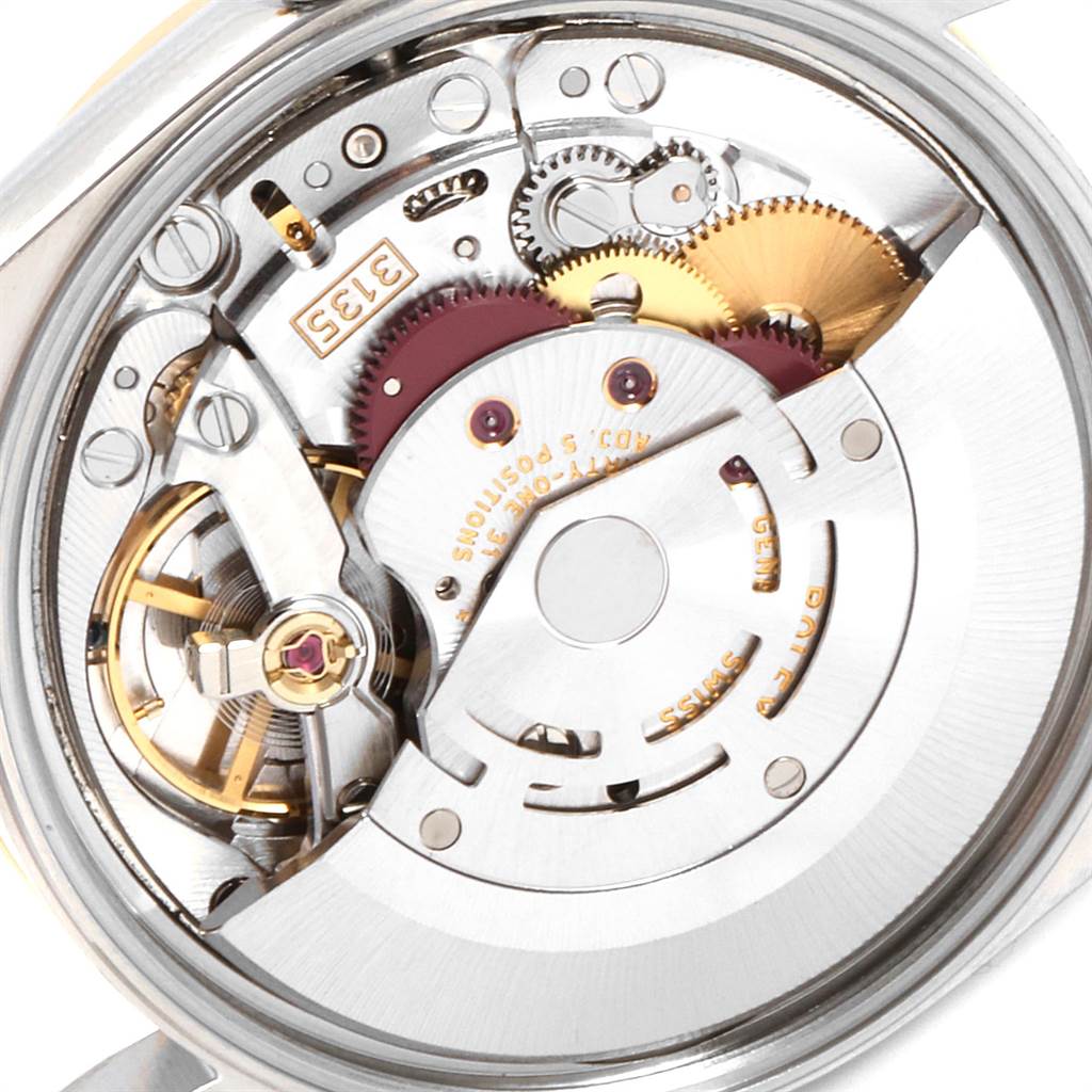 This image shows the intricate movement and internal mechanism of a Rolex Date 15203 Men's Steel and Gold (two tone) Silver Dial 15203 Men's Steel and Gold (two tone) Silver Dial model watch.