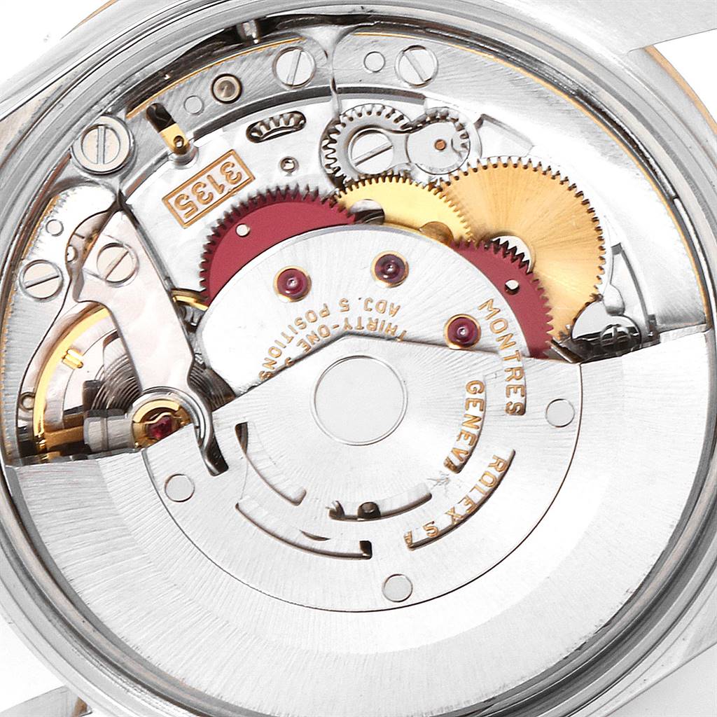 The image shows the movement mechanism of a Rolex Date 15203 Men's Steel and Gold (two tone) White Dial 15203 Men's Steel and Gold (two tone) White Dial model watch from a close-up, angled from the back.