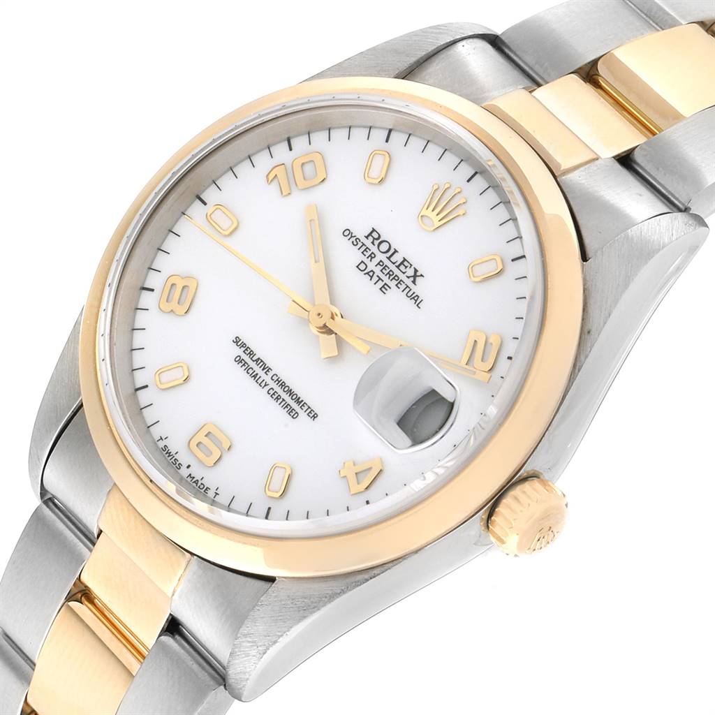 The Rolex Date 15203 Men's Steel and Gold (two tone) White Dial 15203 Men's Steel and Gold (two tone) White Dial model watch is shown at an angled close-up, highlighting its bezel, crown, dial, and bracelet.