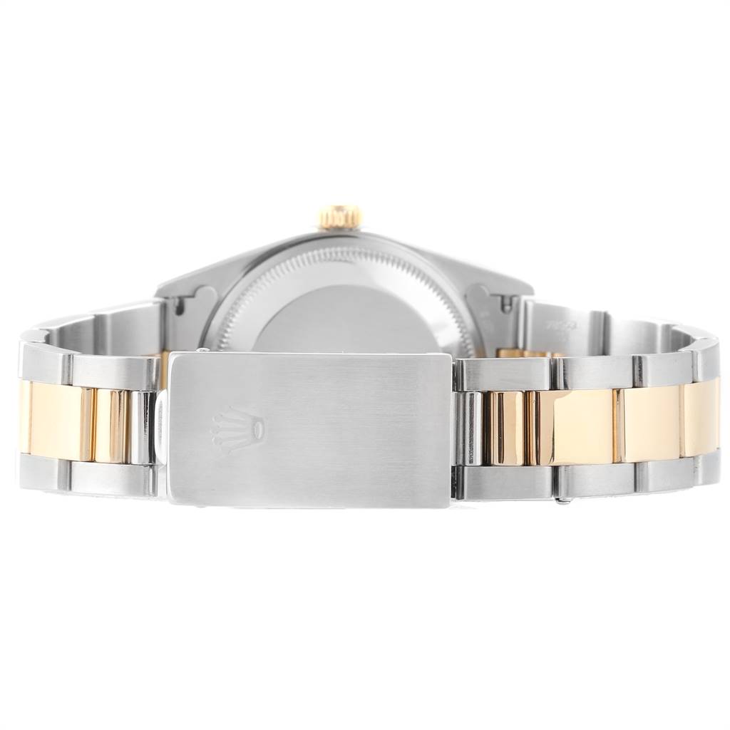 The image shows the back view of a Rolex Date 15203 Men's Steel and Gold (two tone) White Dial 15203 Men's Steel and Gold (two tone) White Dial model with a two-tone bracelet and a clasp displaying the Rolex logo.