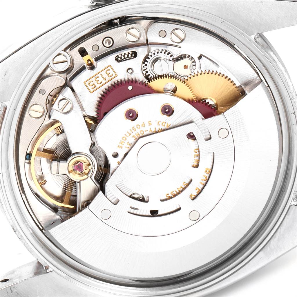 The image shows an open case-back view of the Rolex Date 115200 Men's Stainless Steel White Dial 115200 Men's Stainless Steel White Dial model watch, highlighting its intricate movement components.