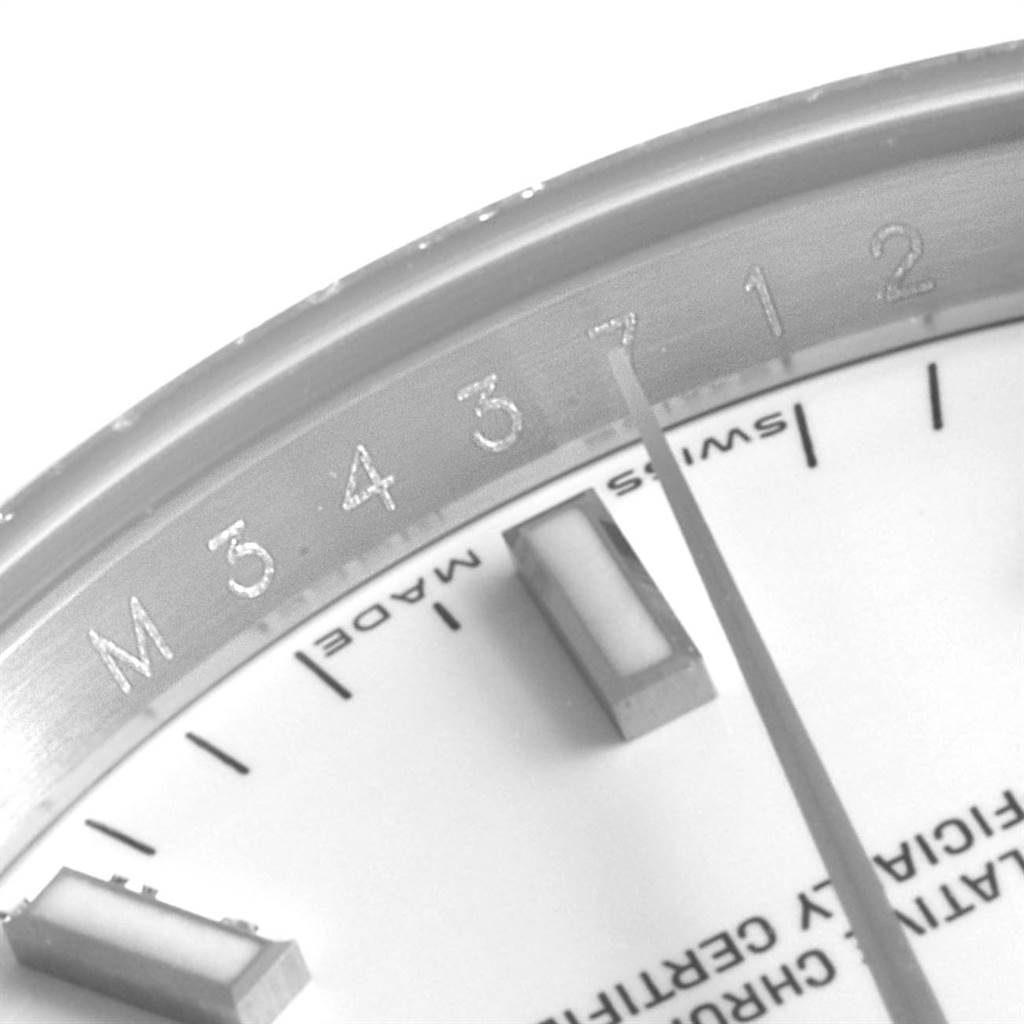 This close-up image shows the dial, minute markers, and part of the bezel of the Rolex Date 115200 Men's Stainless Steel White Dial 115200 Men's Stainless Steel White Dial watch.