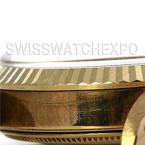 This image shows a close-up of the side profile of the bezel and case of a Rolex Date 1503 Men's Yellow Gold Blue Dial 1503 Men's Yellow Gold Blue Dial model watch.