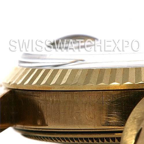 This photo shows a close-up side angle of a Rolex Date 1503 Men's Yellow Gold Blue Dial 1503 Men's Yellow Gold Blue Dial model watch, focusing on the bezel and part of the case.