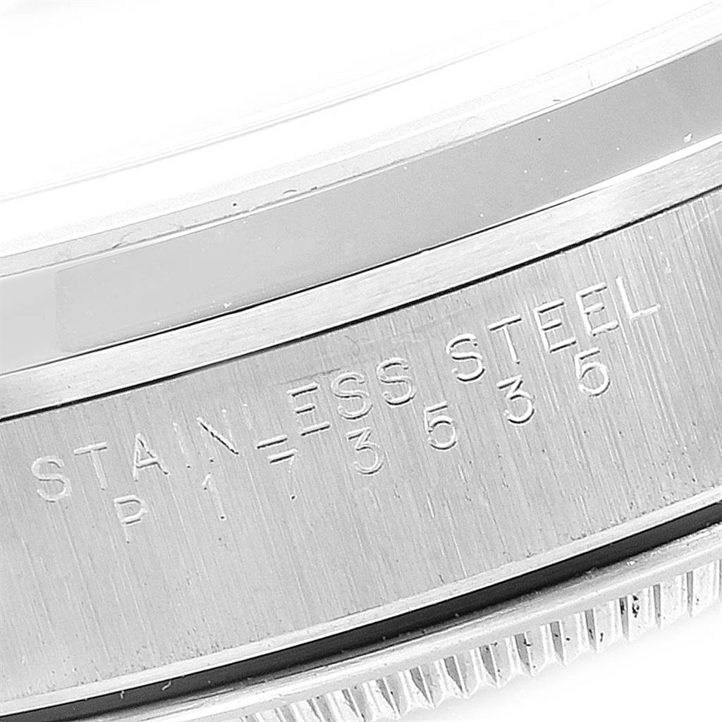 This close-up image shows the engraved side of the casing of a Rolex Date 15200 Men's Stainless Steel Blue Dial 15200 Men's Stainless Steel Blue Dial watch, highlighting the stainless steel material.