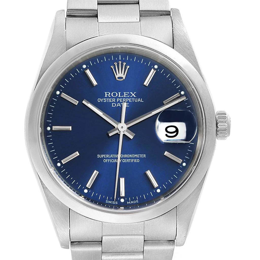 The image shows a front view of a Rolex Oyster Perpetual Date watch, highlighting its blue dial, bezel, and bracelet.