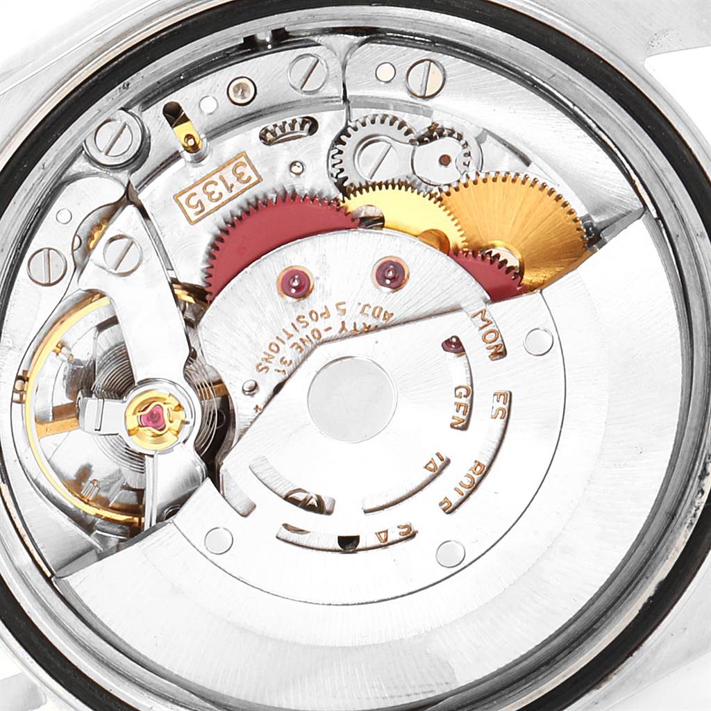 The image shows the inner mechanical movement of a Rolex Date 16233 Men's Steel and Gold (two tone) Blue Dial 16233 Men's Steel and Gold (two tone) Blue Dial model watch, featuring gears and intricate components.