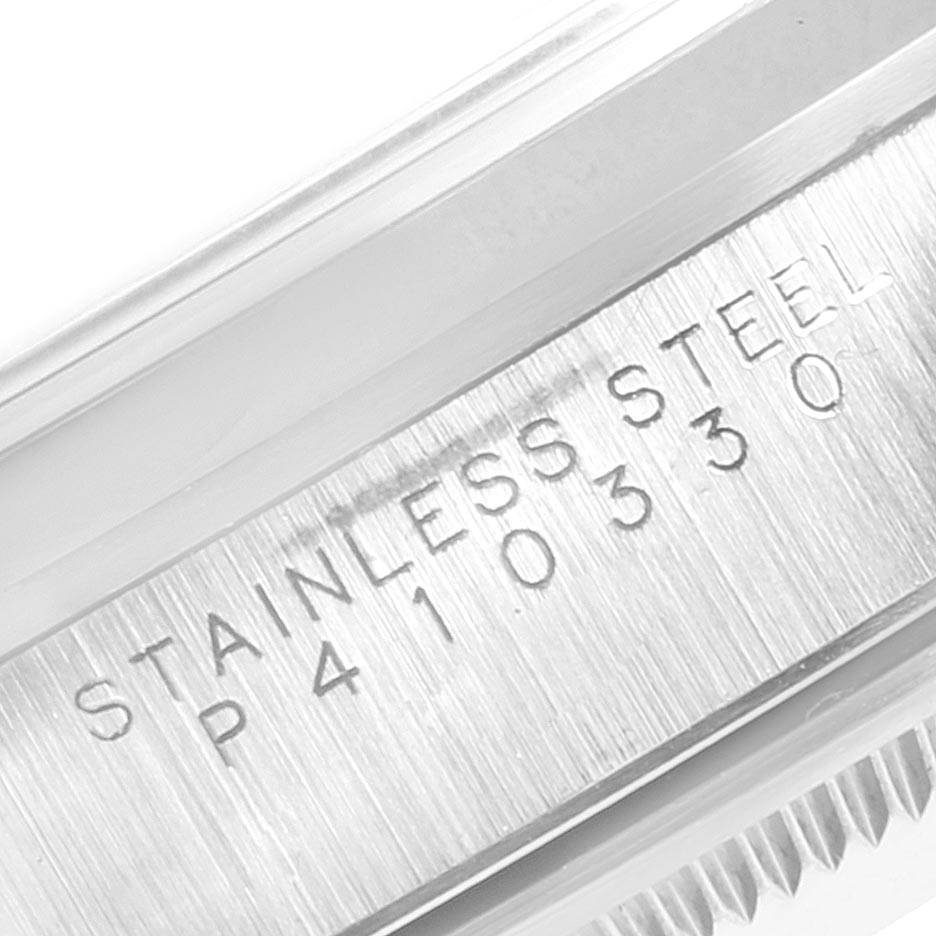 This close-up image shows the engraved stainless steel case of the Rolex Date 15200 Men's Stainless Steel Pink Dial 15200 Men's Stainless Steel Pink Dial model watch.