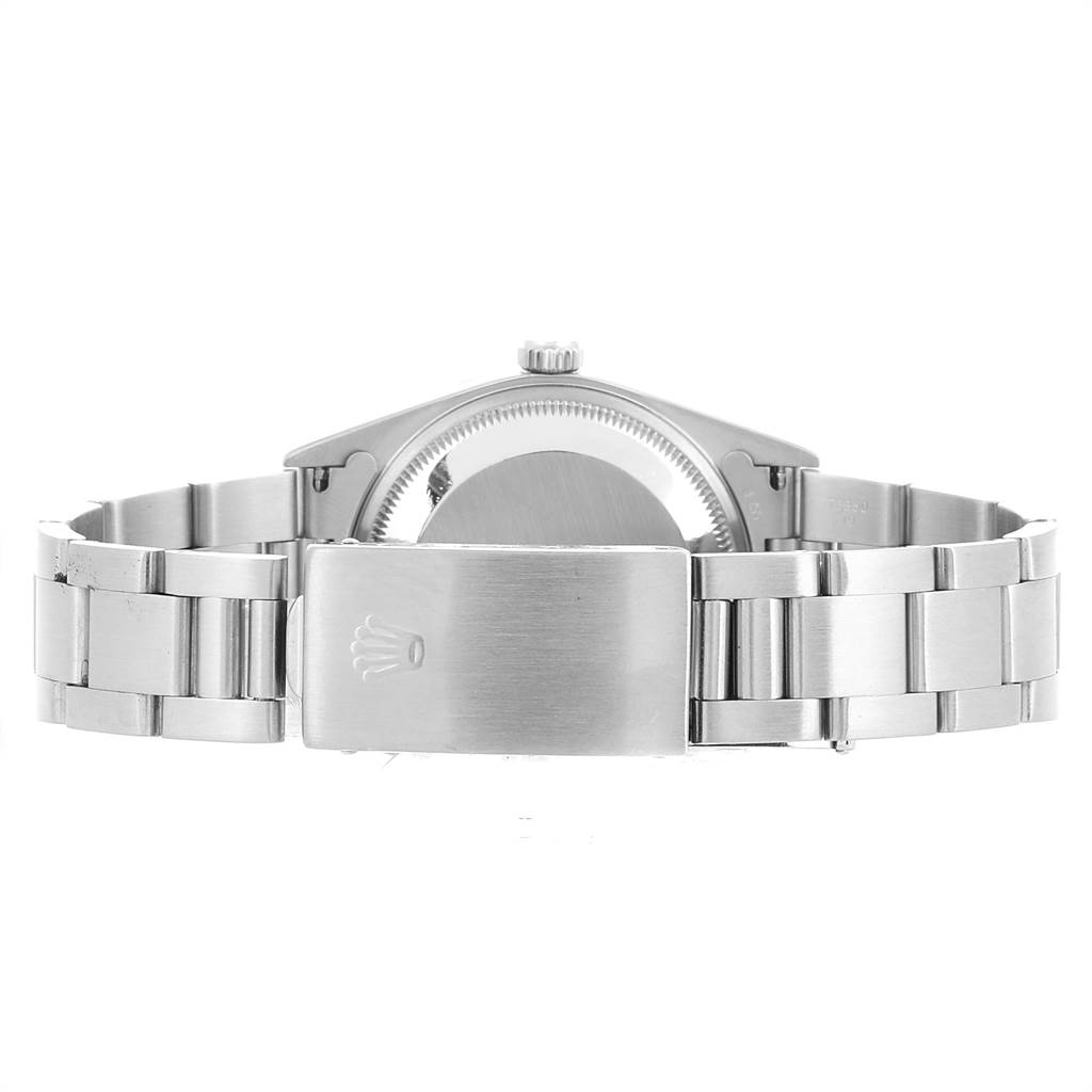 This image shows the back view and bracelet clasp of a Date model by Rolex.