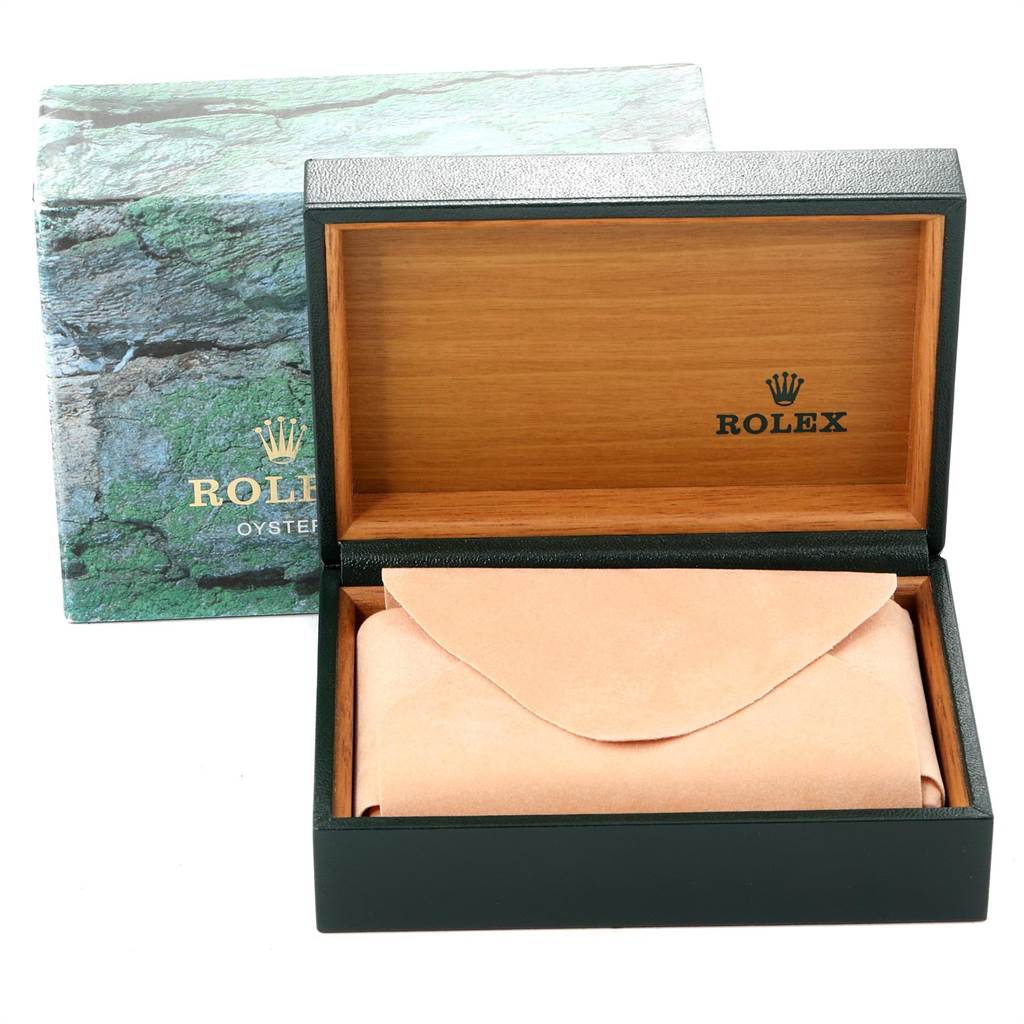 This image shows an open Rolex Date 15210 Men's Stainless Steel Black Dial 15210 Men's Stainless Steel Black Dial model watch box with a pouch inside and outer packaging in the background.