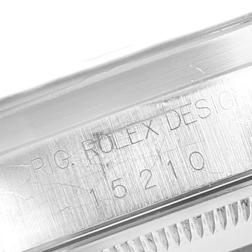 This close-up shows the engraved model number on the side of the case of a Rolex Date 15210 Men's Stainless Steel Black Dial 15210 Men's Stainless Steel Black Dial watch.