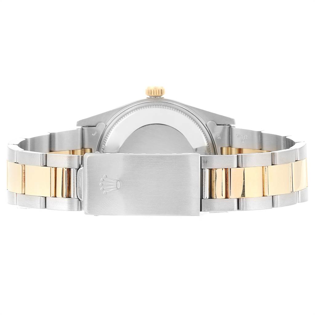 This image shows the backside of a Rolex Date 15053 Men's Steel and Gold (two tone) Silver Dial 15053 Men's Steel and Gold (two tone) Silver Dial model watch, featuring its clasp and two-tone bracelet.