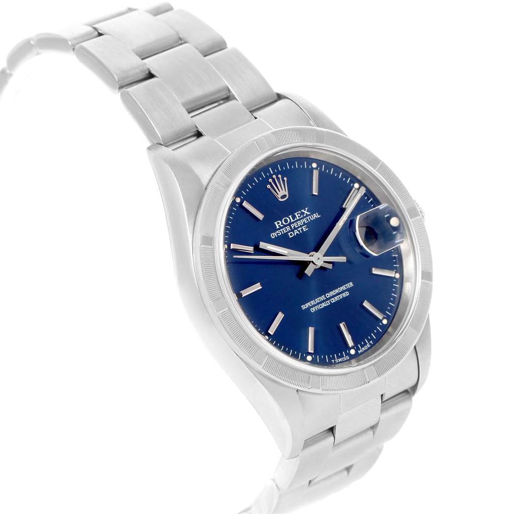 The image shows a Rolex Date 15210 Men's Stainless Steel Blue Dial 15210 Men's Stainless Steel Blue Dial watch with a blue dial, viewed from an angled front perspective highlighting the face and bracelet.