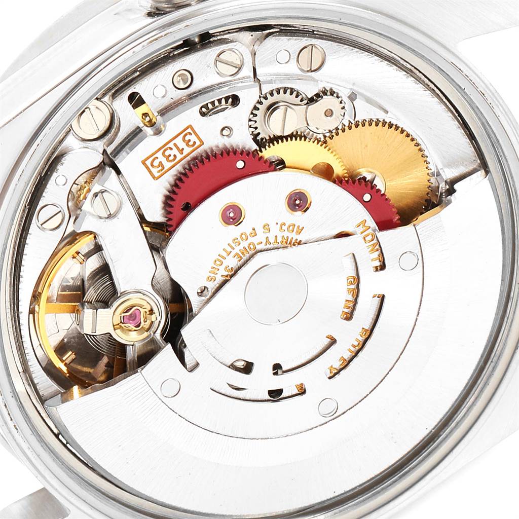 This image shows the inner mechanism and gears of a Rolex Date 15210 Men's Stainless Steel Blue Dial 15210 Men's Stainless Steel Blue Dial model watch from a rear view.