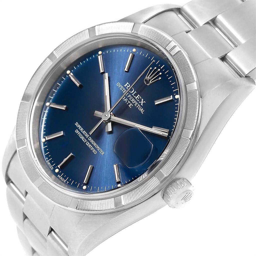 The image shows a close-up of a Rolex Date 15210 Men's Stainless Steel Blue Dial 15210 Men's Stainless Steel Blue Dial model, highlighting its blue dial, bezel, and part of the bracelet at an angle.