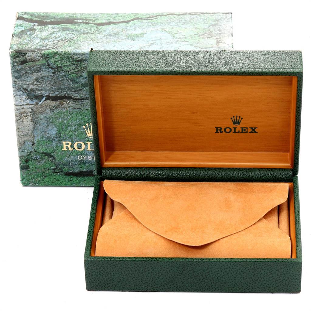 The image shows an open Rolex Date 15200 Men's Stainless Steel Silver Dial 15200 Men's Stainless Steel Silver Dial model watch box with green exterior and tan interior.