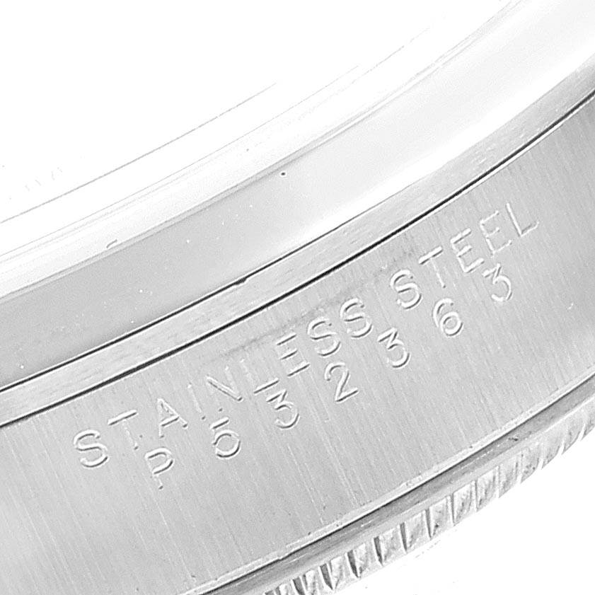 The image shows a close-up of the side engraving and bezel of a Rolex Date 15200 Men's Stainless Steel Silver Dial 15200 Men's Stainless Steel Silver Dial model in stainless steel.