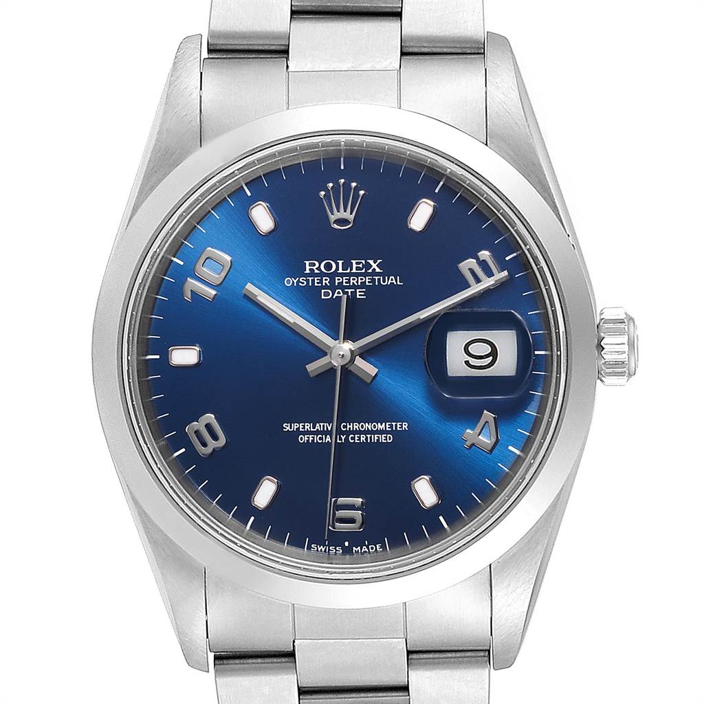 The image shows a front view of a Rolex Oyster Perpetual Date watch, highlighting the blue dial, date window, and stainless steel bracelet.