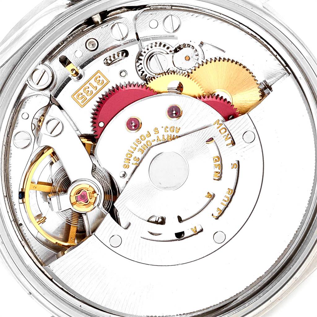 This image shows a close-up of the internal mechanics of a Rolex Date 15210 Men's Stainless Steel White Dial 15210 Men's Stainless Steel White Dial model watch, highlighting gears and movement parts.