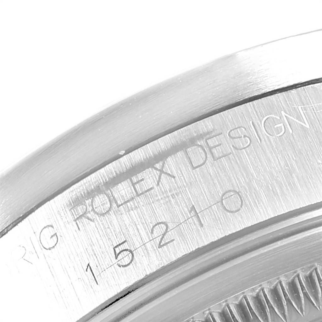 This image shows a detailed close-up of the outer rim and engravings on the case back of the Rolex Date 15210 Men's Stainless Steel Black Dial 15210 Men's Stainless Steel Black Dial model.