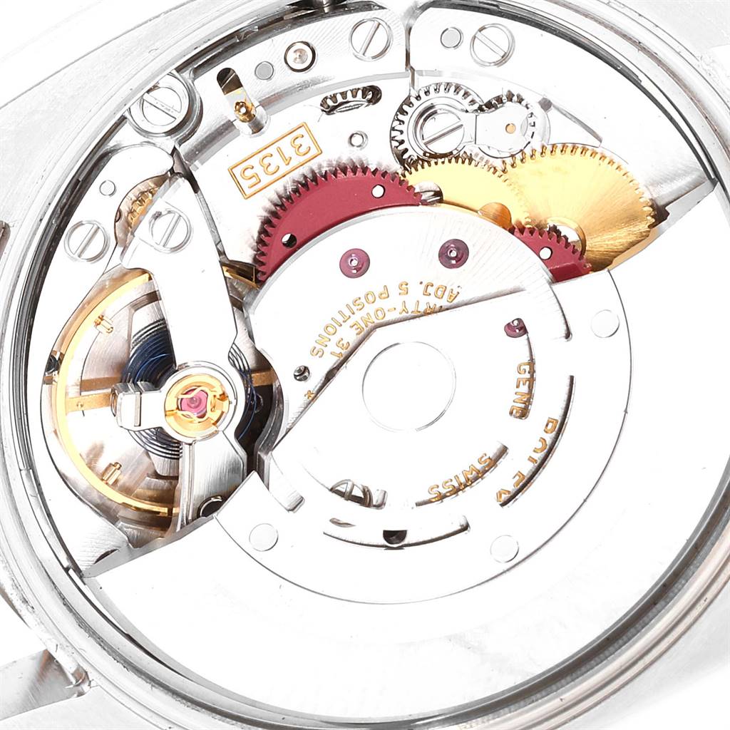 The image shows a close-up view of the movement inside a Rolex Date 115234 Men's Stainless Steel White Dial 115234 Men's Stainless Steel White Dial model watch.