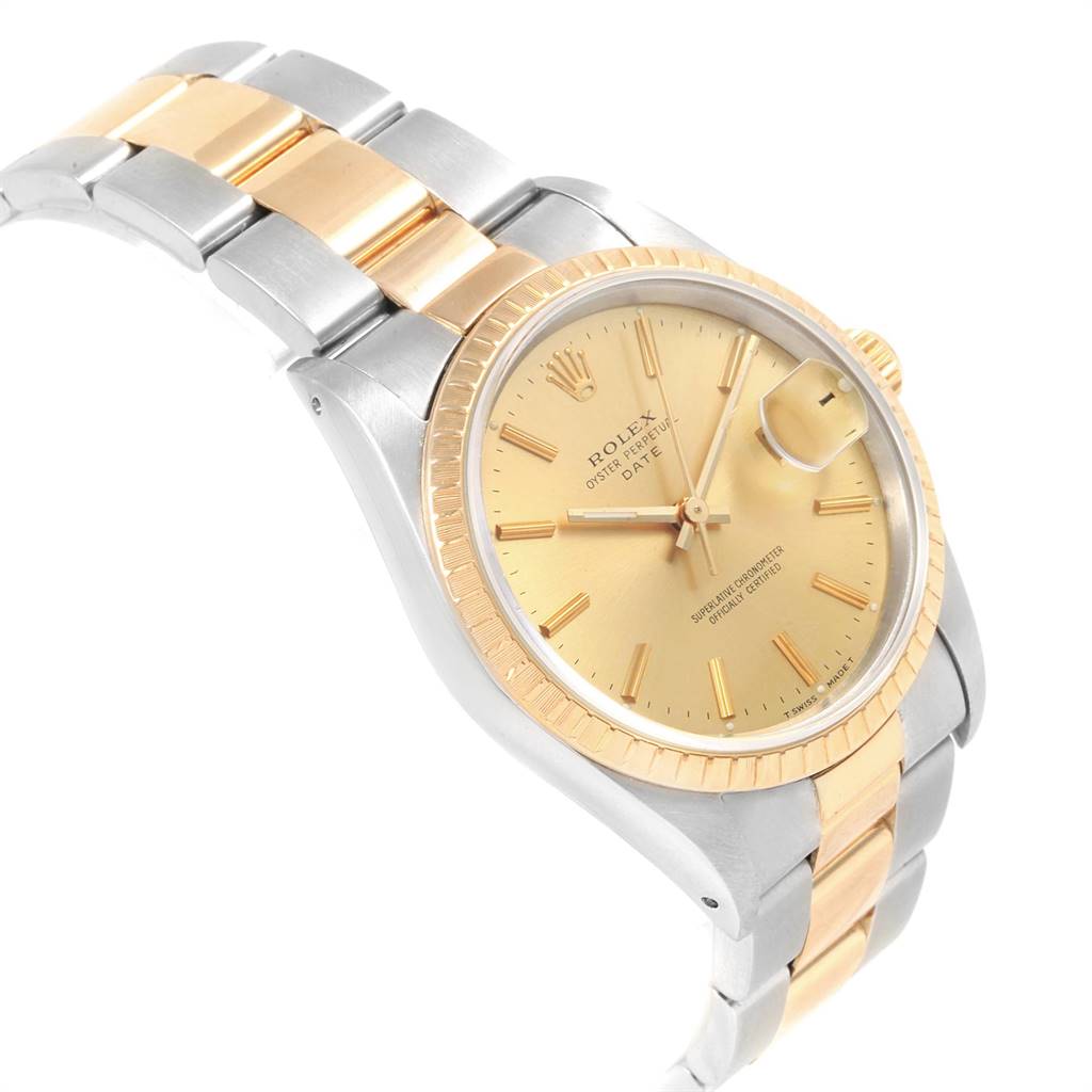 The image shows a Rolex Date 15223 Men's Steel and Gold (two tone) Champagne Dial 15223 Men's Steel and Gold (two tone) Champagne Dial model at a slight angle, highlighting the dial, bezel, crown, and two-tone bracelet.