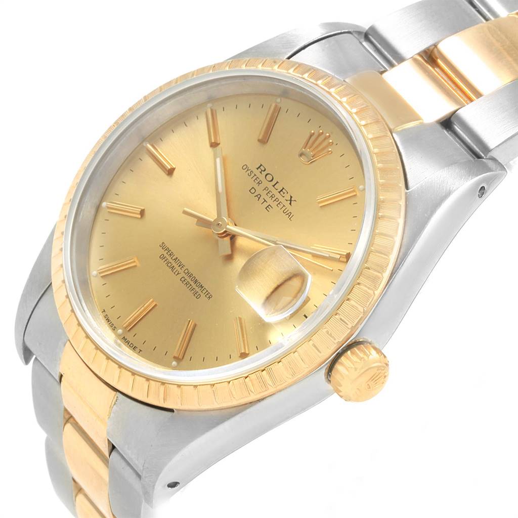 The image shows a close-up angle of a Rolex Date 15223 Men's Steel and Gold (two tone) Champagne Dial 15223 Men's Steel and Gold (two tone) Champagne Dial model watch, highlighting its gold dial, bezel, and two-tone bracelet.