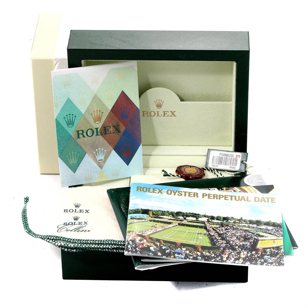 The image shows the accessories of a Rolex Date 15210 Men's Stainless Steel Blue Dial 15210 Men's Stainless Steel Blue Dial model, including the box, manuals, tag, and warranty card.