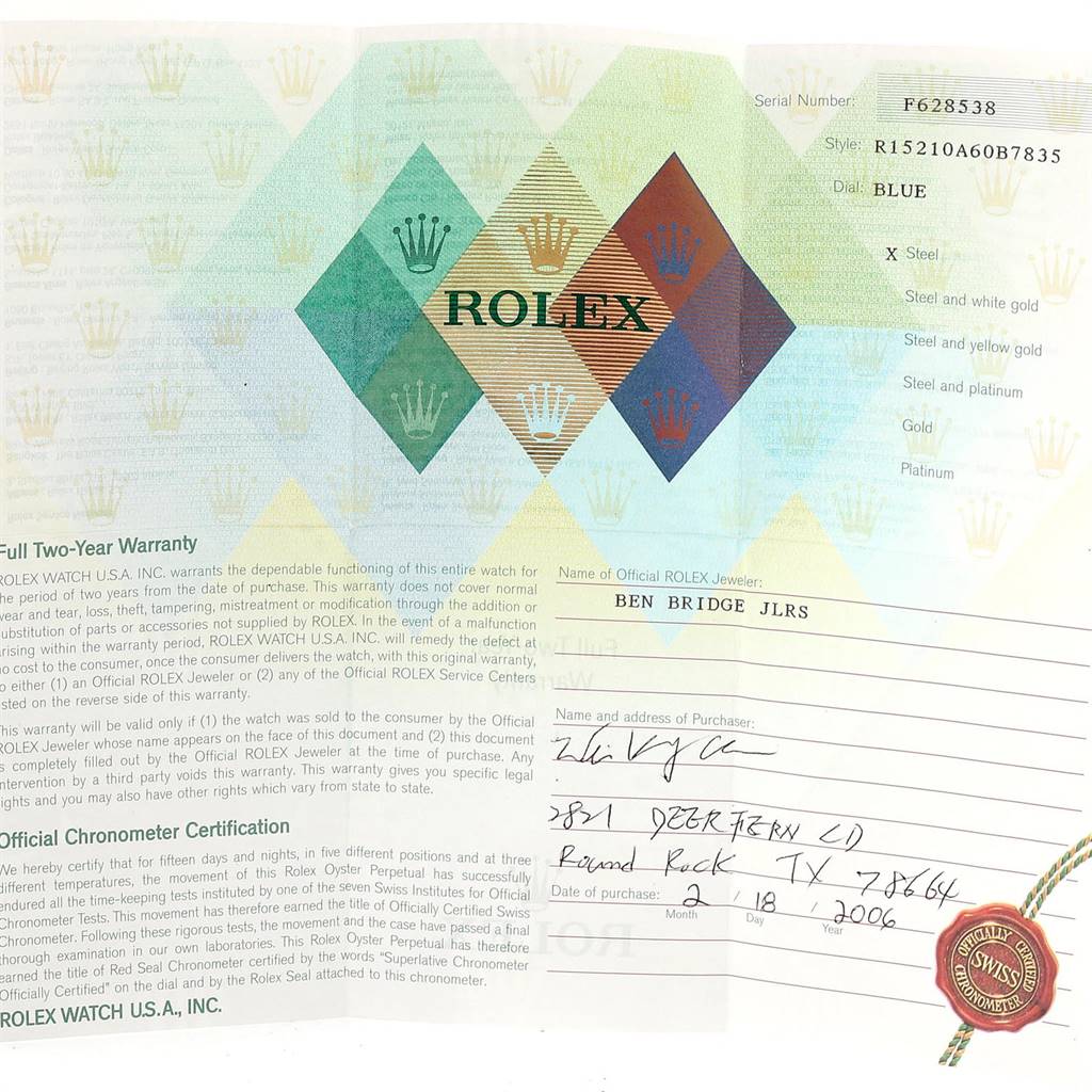 This image shows the warranty and certification card for a Rolex Date 15210 Men's Stainless Steel Blue Dial 15210 Men's Stainless Steel Blue Dial model watch.