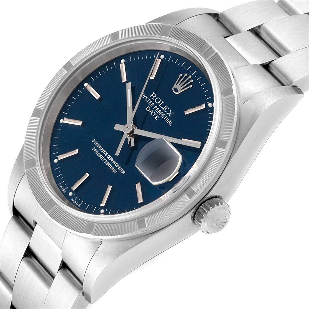 The Rolex Date 15210 Men's Stainless Steel Blue Dial 15210 Men's Stainless Steel Blue Dial model watch is shown from an oblique angle, highlighting its blue dial, fluted bezel, and crown.
