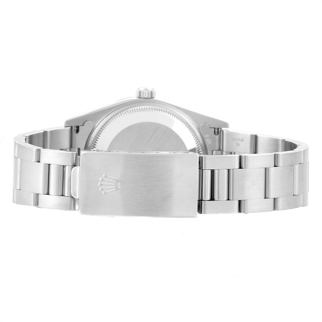 The image shows the rear view of a Rolex Date 15210 Men's Stainless Steel Blue Dial 15210 Men's Stainless Steel Blue Dial model watch, focusing on the case back and the clasp of the metal bracelet.