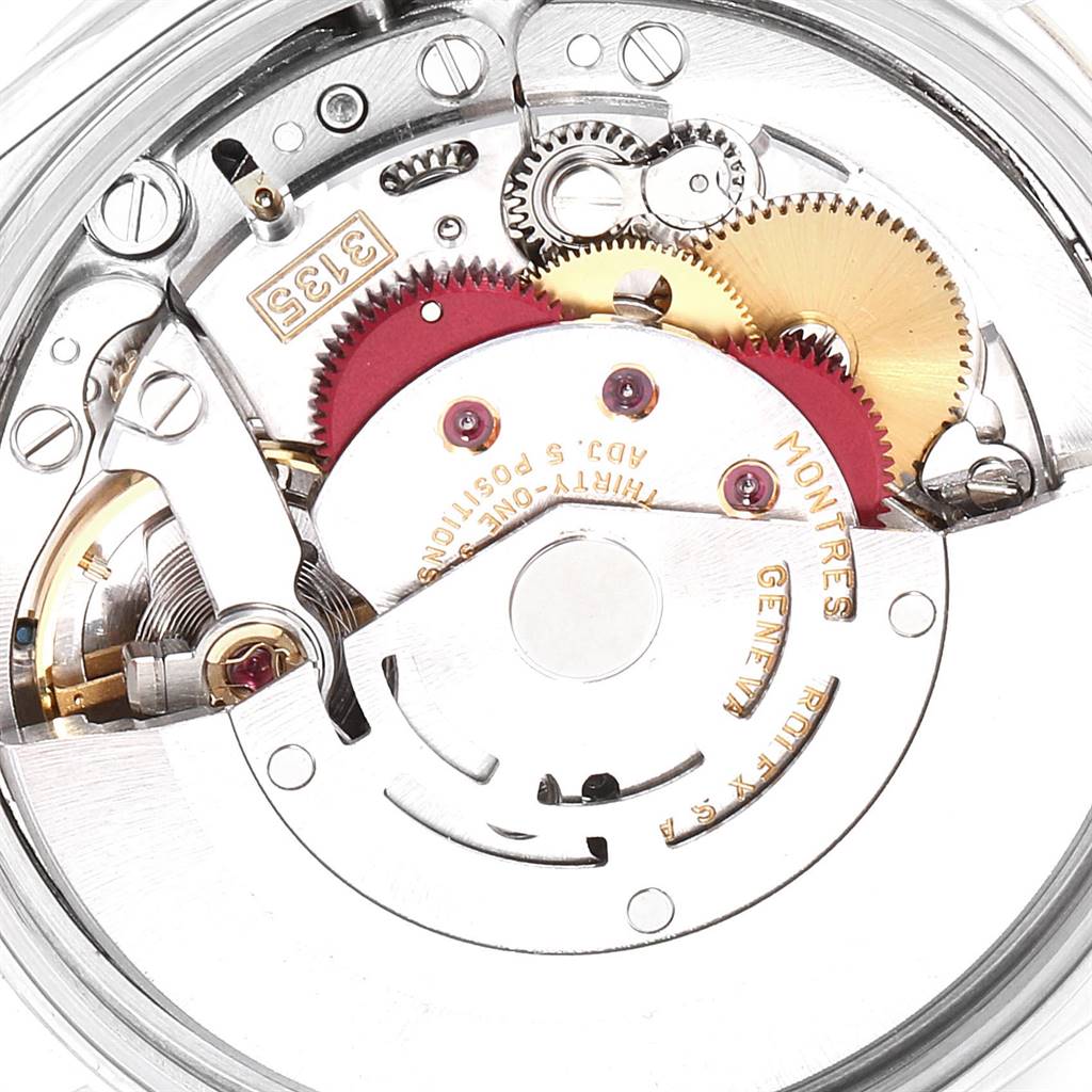 The image shows a close-up of the mechanical movement inside a Rolex Date 15223 Men's Steel and Gold (two tone) Blue Dial 15223 Men's Steel and Gold (two tone) Blue Dial model watch, highlighting gears and internal components.