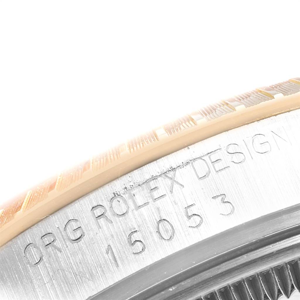 The image shows a close-up of the side and bezel of a Rolex Date 15053 Men's Steel and Gold (two tone) Champagne Dial 15053 Men's Steel and Gold (two tone) Champagne Dial model, revealing the engraving "ORIG ROLEX DESIGN 15053."