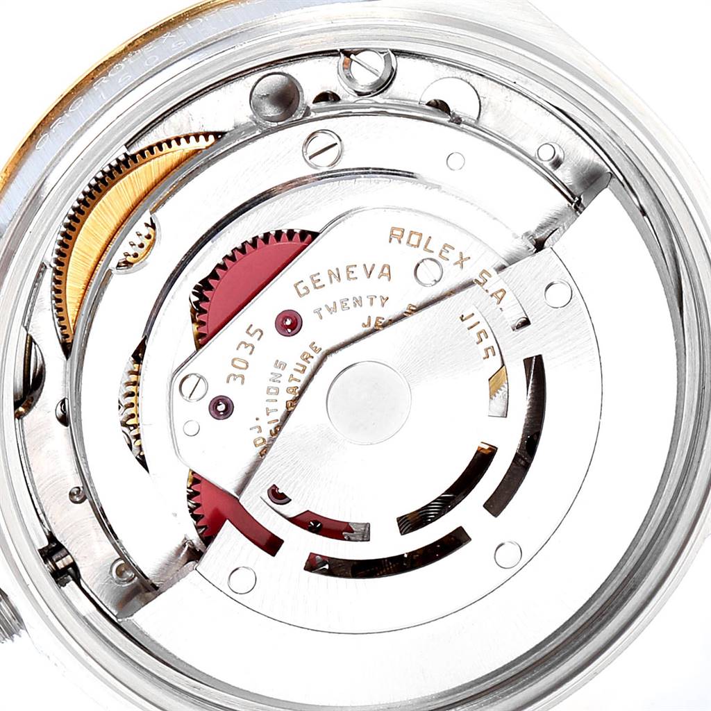 This close-up shows the internal mechanism of the Rolex Date 15053 Men's Steel and Gold (two tone) Champagne Dial 15053 Men's Steel and Gold (two tone) Champagne Dial model watch, highlighting the rotor and gears.