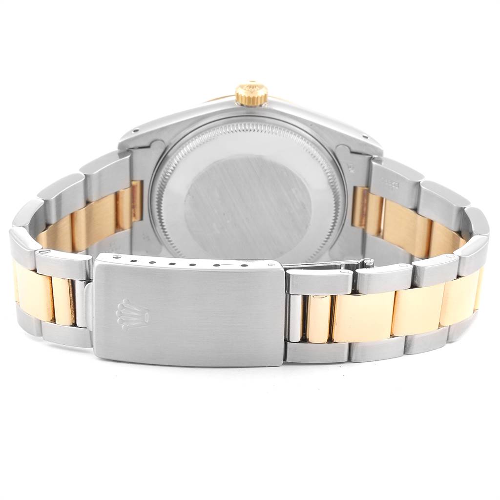 The image shows the back case and bi-metal bracelet of a Rolex Date 15053 Men's Steel and Gold (two tone) Champagne Dial 15053 Men's Steel and Gold (two tone) Champagne Dial model watch.
