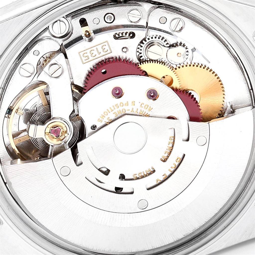 This image shows a close-up view of the movement and internal mechanics of a Rolex Date 15203 Men's Steel and Gold (two tone) Silver Dial 15203 Men's Steel and Gold (two tone) Silver Dial watch model, highlighting its gears and components.