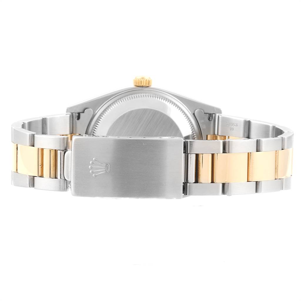 The image shows the back case and clasp of a Rolex Date 15203 Men's Steel and Gold (two tone) Silver Dial 15203 Men's Steel and Gold (two tone) Silver Dial model watch.