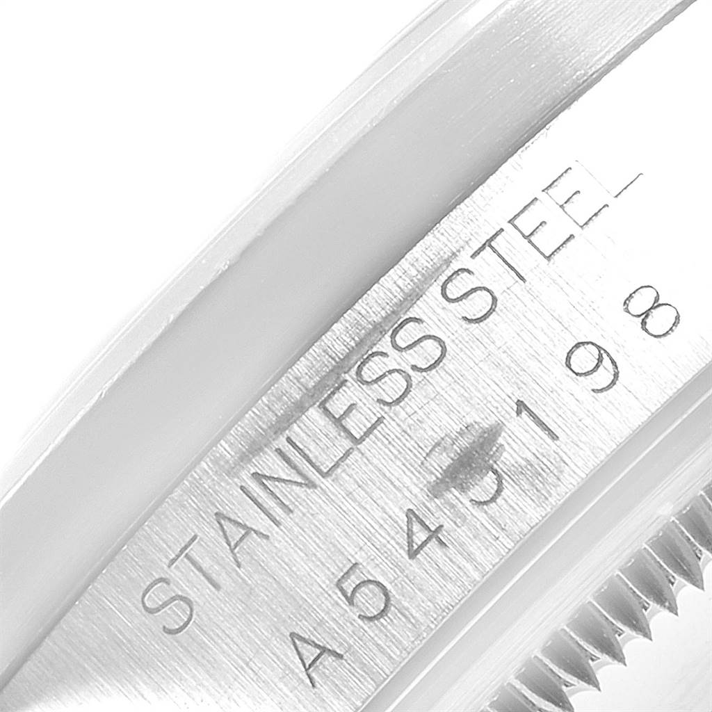 This image shows a close-up angle of the side and serial number area of the Rolex Date 15210 Men's Stainless Steel White Dial 15210 Men's Stainless Steel White Dial model watch.