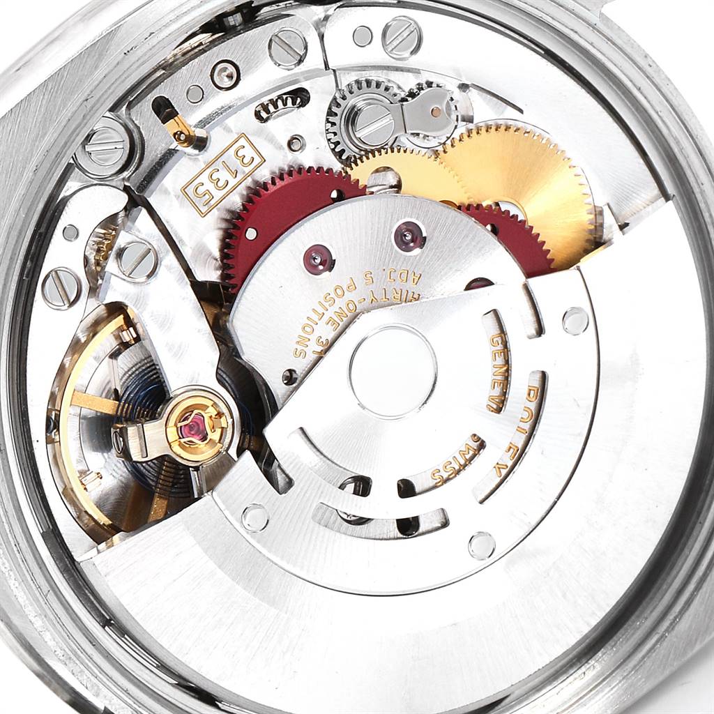 Close-up view of the movement and inner mechanisms of the Rolex Date 115234 Men's Stainless Steel Black Dial 115234 Men's Stainless Steel Black Dial model watch, highlighting gears and intricate components.