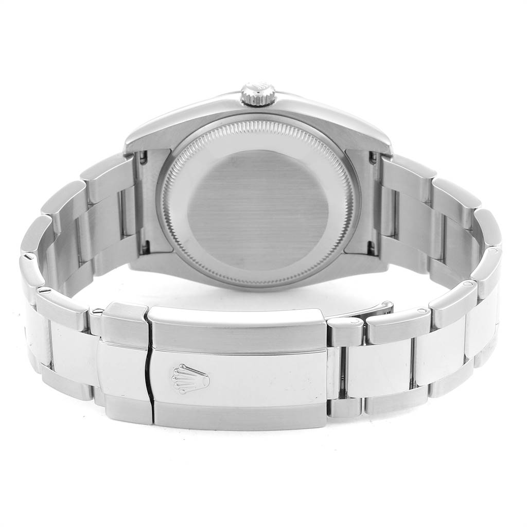 The image shows the back case and bracelet clasp of a Rolex Date 115234 Men's Stainless Steel Black Dial 115234 Men's Stainless Steel Black Dial watch from a rear angle.