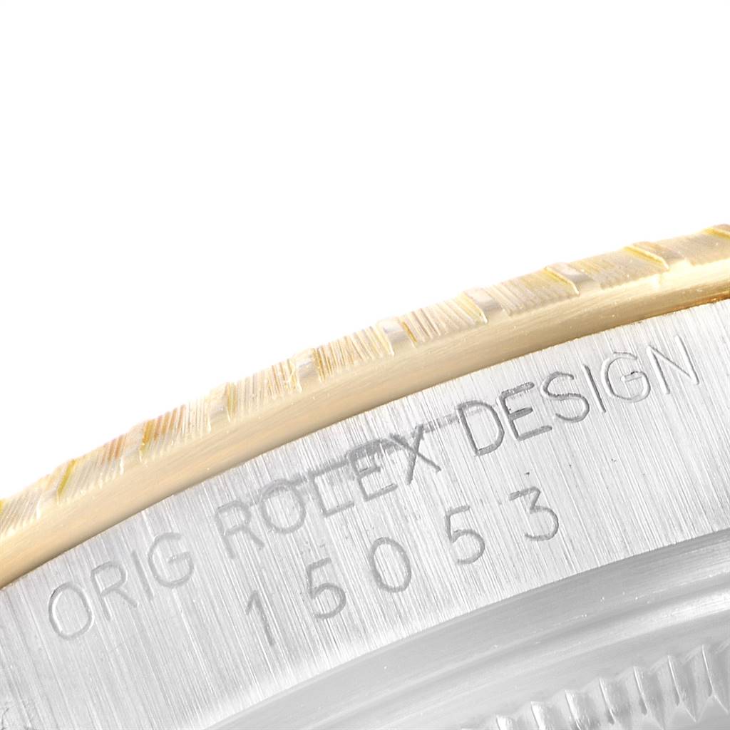 The image shows a close-up of the serial number and fluted bezel of a Rolex Date 15053 Men's Steel and Gold (two tone) Black Dial 15053 Men's Steel and Gold (two tone) Black Dial model watch.
