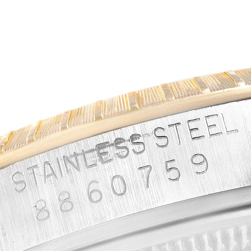 This close-up angle shows the stainless steel casing and serial number of the Rolex Date 15053 Men's Steel and Gold (two tone) Black Dial 15053 Men's Steel and Gold (two tone) Black Dial model watch.