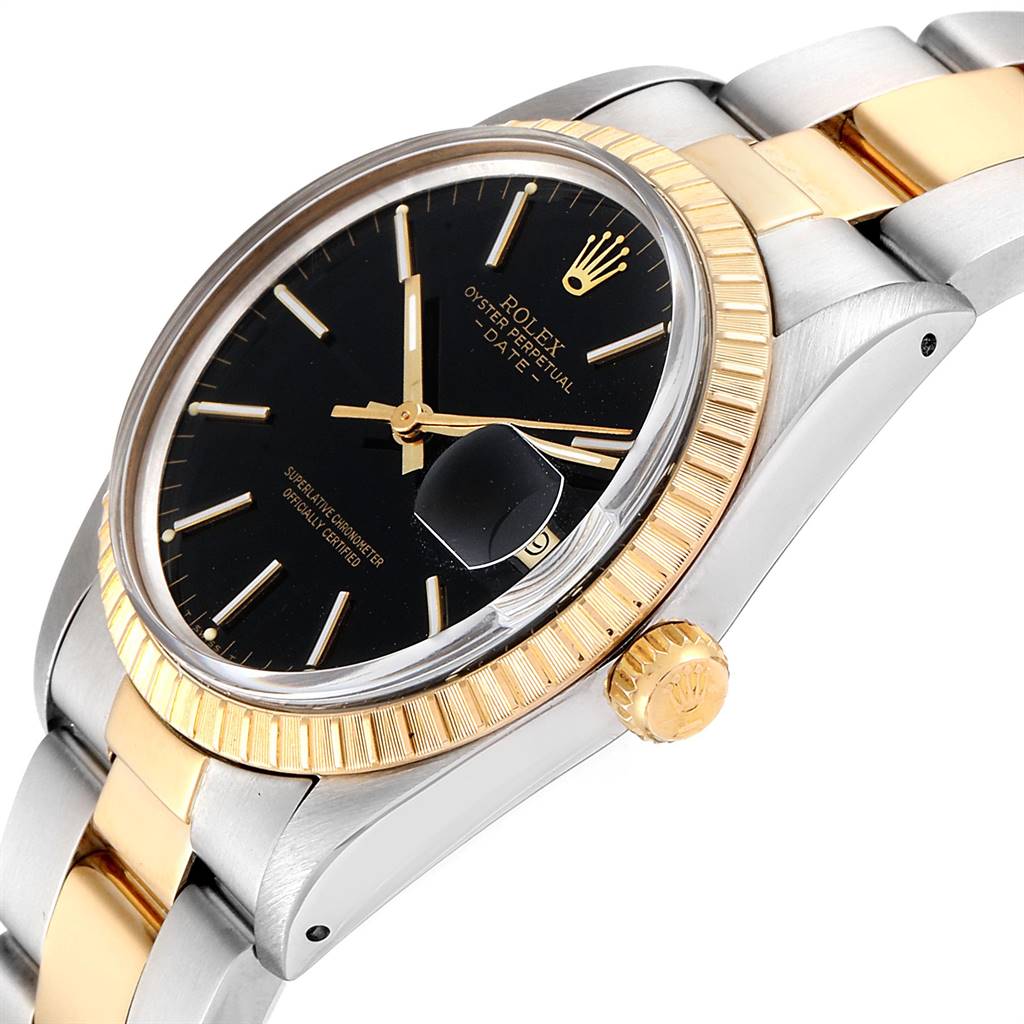 This image shows a Rolex Date 15053 Men's Steel and Gold (two tone) Black Dial 15053 Men's Steel and Gold (two tone) Black Dial model watch at an oblique angle, highlighting its black dial, fluted gold bezel, and two-tone bracelet.