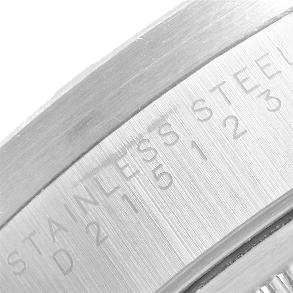 This is a close-up image of the case back of a Rolex Date 15210 Men's Stainless Steel Silver Dial 15210 Men's Stainless Steel Silver Dial model watch, showing the engraved text "STAINLESS STEEL."