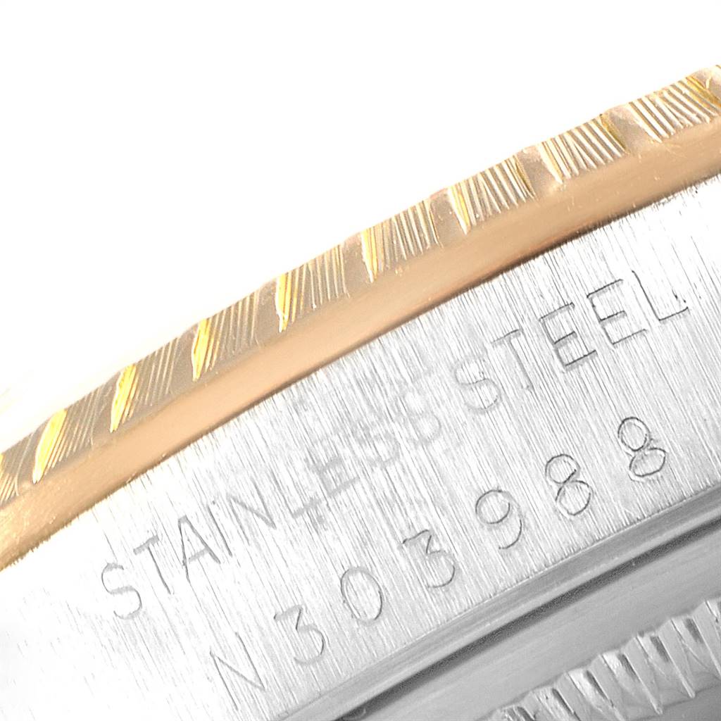 The image shows a close-up of the bezel, stainless steel case, and serial number on a Rolex Date 15223 Men's Steel and Gold (two tone) White Dial 15223 Men's Steel and Gold (two tone) White Dial watch.