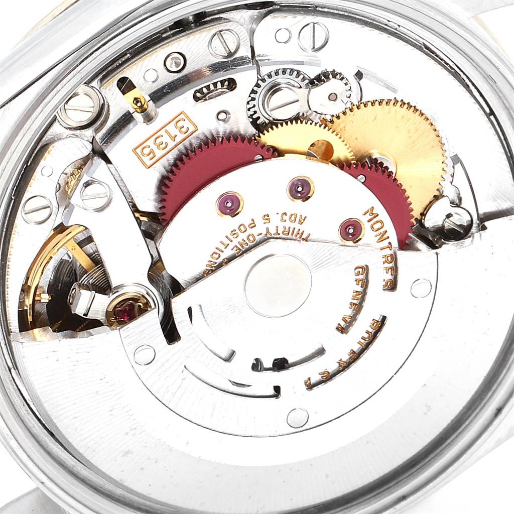 This image shows the internal mechanism of a Rolex Date 15223 Men's Steel and Gold (two tone) White Dial 15223 Men's Steel and Gold (two tone) White Dial model, highlighting gears and components from a close-up angle.