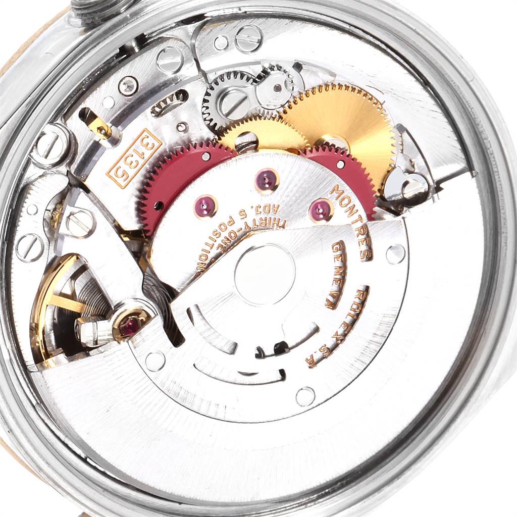 The image shows the internal mechanism of a Rolex Date 15223 Men's Steel and Gold (two tone) Silver Dial 15223 Men's Steel and Gold (two tone) Silver Dial watch, highlighting the gears and rotor.